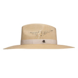 Beige straw hat with decorative band on a white background