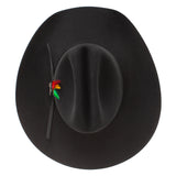 Black fedora hat with a colorful feather on a white background