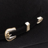 Close-up of a black hat band and silver color buckle