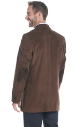 Man wearing a western chestnut blazer over a light blue shirt on a white background