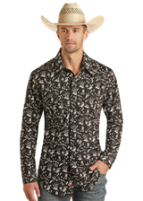 Man wearing a patterned shirt and cowboy hat on a white background