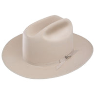 Beige cowboy hat with a band on a white background