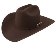 Brown cowboy hat with a silver buckle on a white background