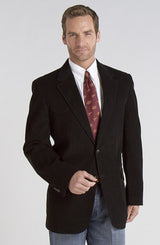 Man wearing a western black blazer over a light blue shirt on a white background